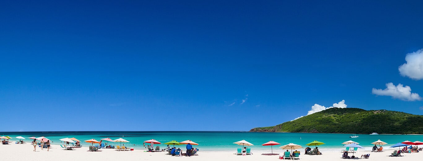 Beach umbrellas beside the sea